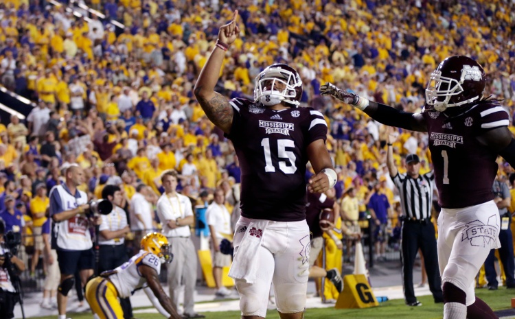 Mississippi State quarterback Dak Prescott (15) celebrates his 56 yard touchdown carry with wide receiver De'Runnya Wilson (1) in the second half of an NCAA college football game against Mississippi State in Baton Rouge, La., Saturday, Sept. 20, 2014. (AP Photo/Gerald Herbert)